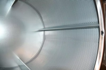 Inside the stainless steel drum of a Speed Queen dryer