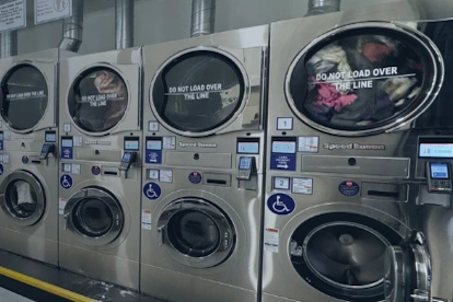 broadway lmat 6x4 Speed Queen stack washer dryers at a laundromat on Broadway